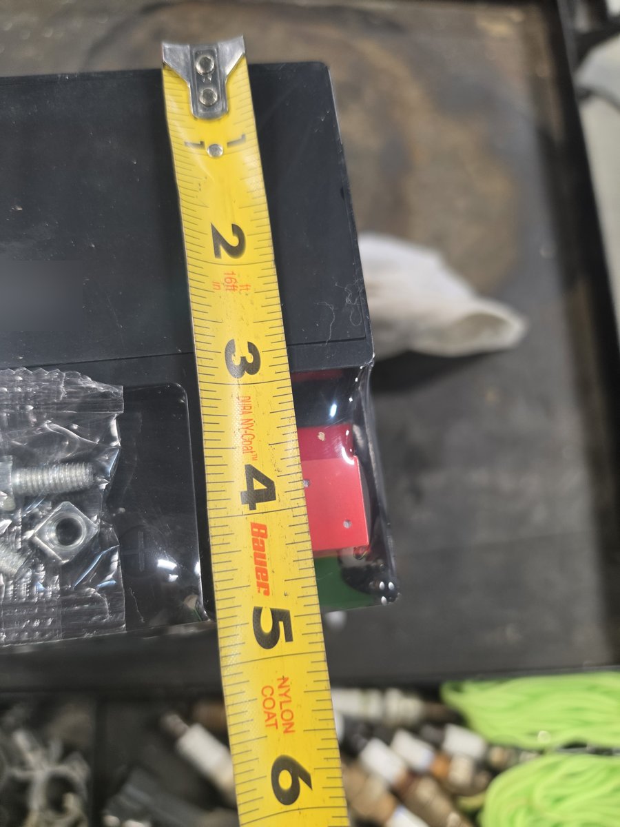 Tape measure showing the battery width
