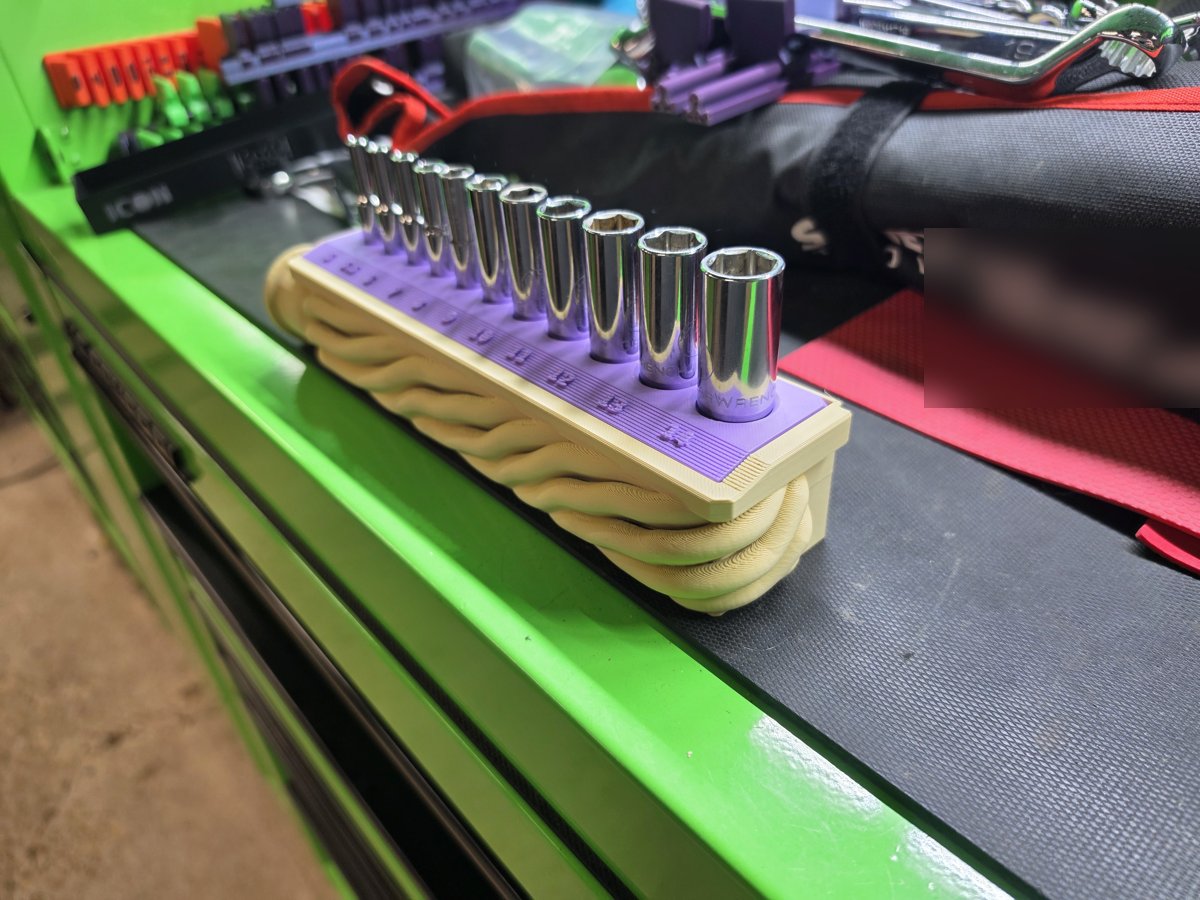 Holder from the other end, with the sockets standing in their size-labeled slots