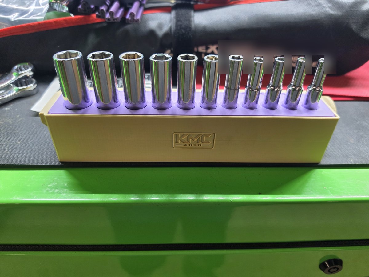 KMC logo side of the holder with all 11 sockets