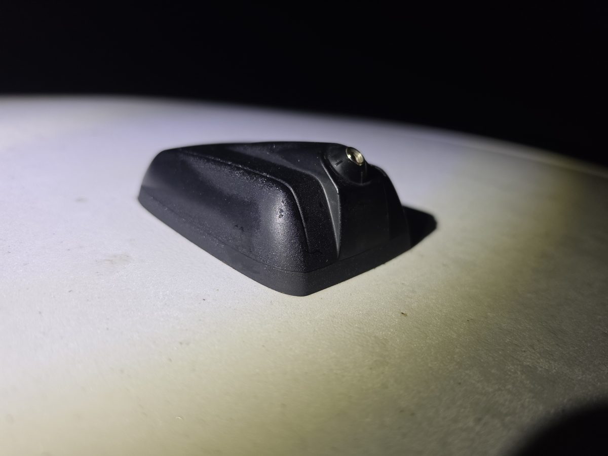 Factory Ford Fusion antenna base with the mast removed, side view
