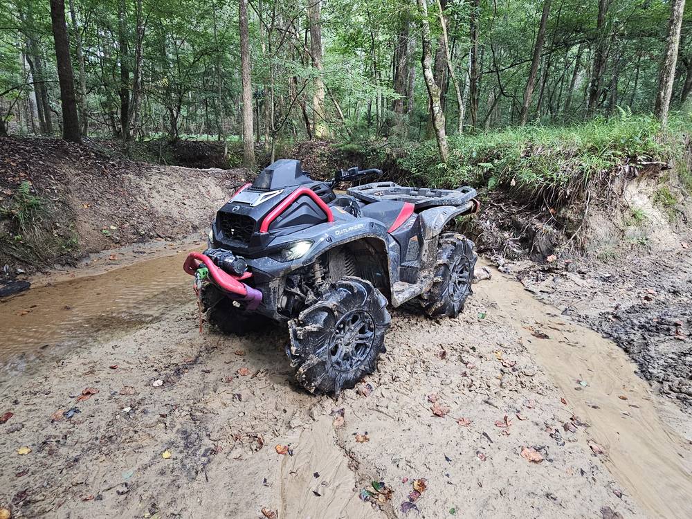 Can-Am Outlander XMR in a creek